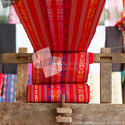 Image of Handmade silk textile industry, silk scarf on a old machine