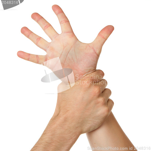 Image of Man holding woman by wrist