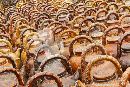 Image of Many teapots waiting to be sold at a factory