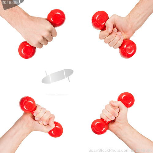 Image of Red dumbbells in the hands of a man, isolated