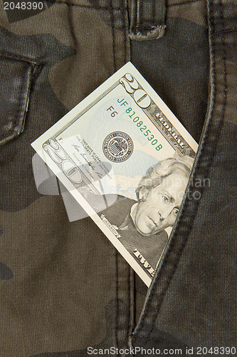 Image of Macro shot of trendy jeans with american 20 dollar bill