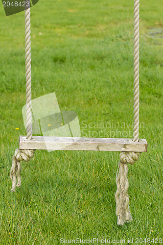 Image of Old wooden tree swing