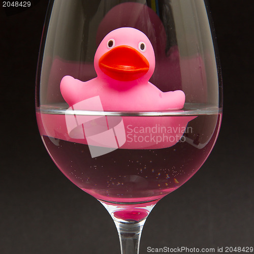 Image of Pink rubber duck in a wineglass