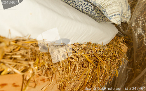 Image of Bed on top of a haystac