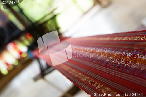 Image of Handmade silk textile industry, silk scarf on a old machine