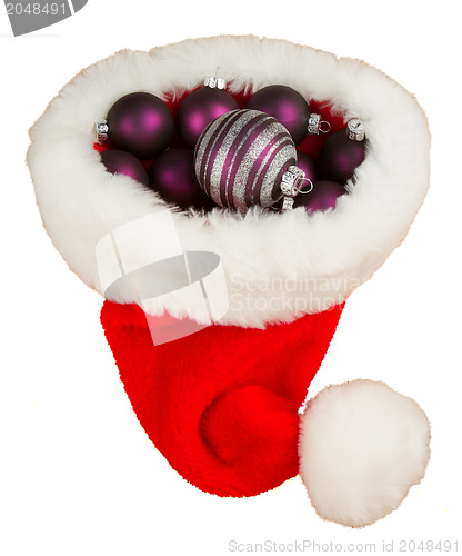 Image of Santas hat filled with Christmas balls