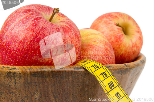 Image of Red apples with a yellow tape-measure