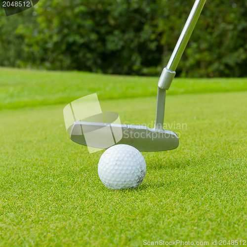 Image of Golf ball on front of a driver