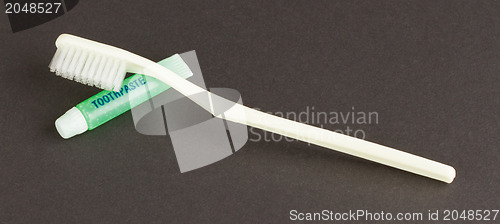 Image of Toothbrush and green toothpaste isolated