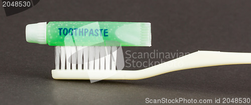 Image of Toothbrush and green toothpaste isolated