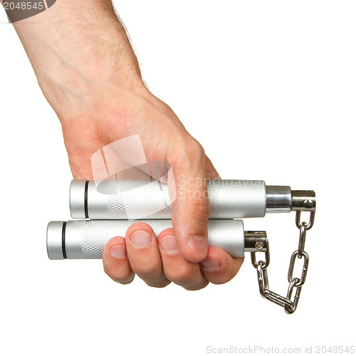 Image of Hand holding a metal nunchaku