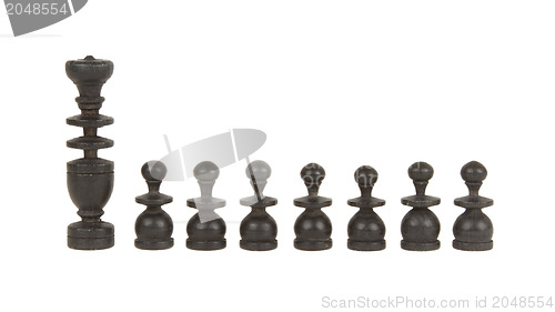 Image of Set of old handcarved chess pieces isolated