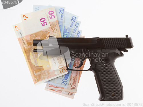 Image of Semi-automatic gun and money isolated