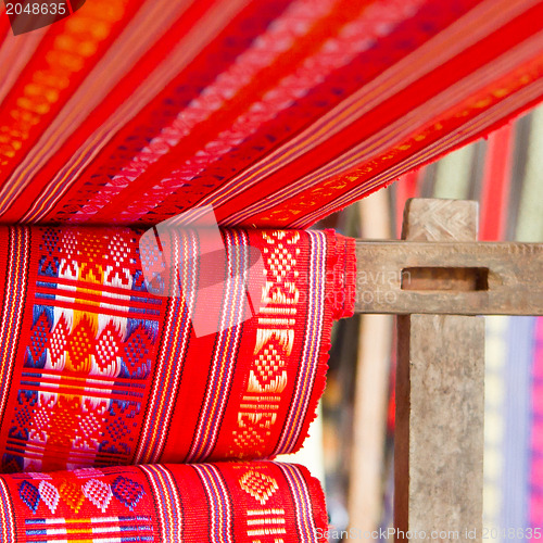 Image of Handmade silk textile industry, silk scarf on a old machine