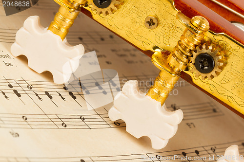 Image of Old music sheet and a guitar