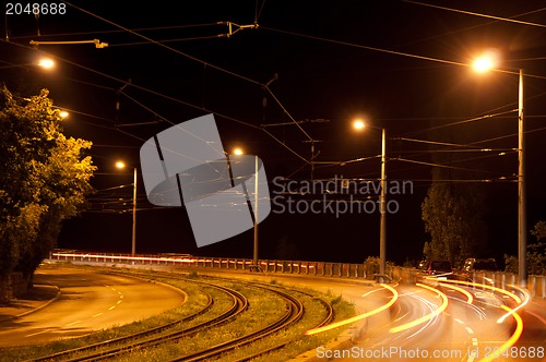 Image of Speeding cars at night