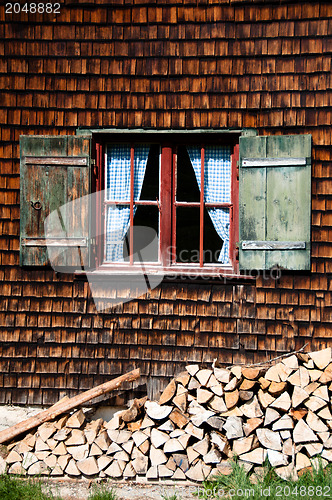 Image of Ancient window on log house wooden wall