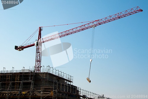 Image of Construction site with crane and building