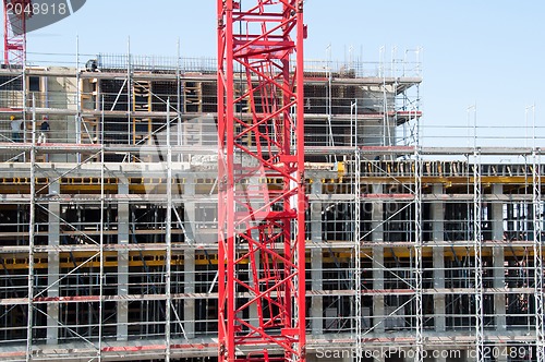 Image of Construction site with crane and building