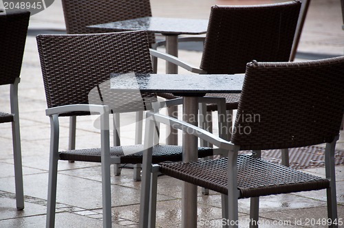 Image of Wet Chairs And Tables Outside Cafe