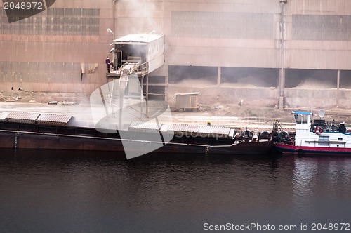 Image of transport ship being loaded