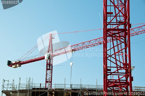 Image of Construction site with cranes and building