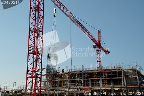 Image of Construction site with cranes and building
