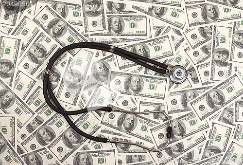 Image of Stethoscope and dollars