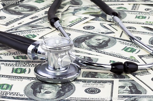 Image of Stethoscope and dollars