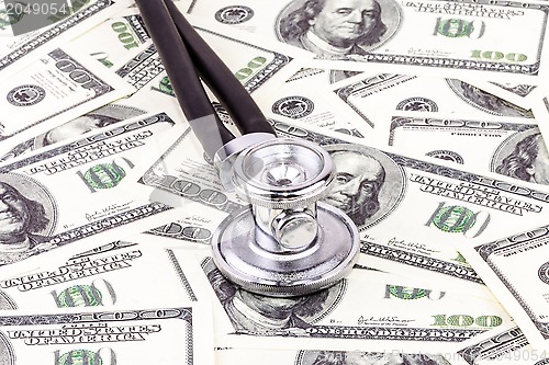 Image of Stethoscope and dollars