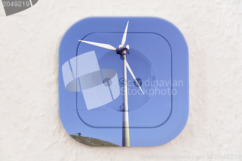 Image of Conceptual: Wind Turbine over Power Outlet