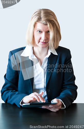 Image of Business woman with digital tablet PC and headset