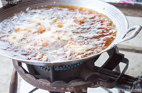 Image of Chicken deep frying in hot oil