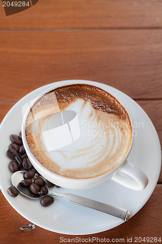 Image of Cup of hot caffe latte with coffee grain 