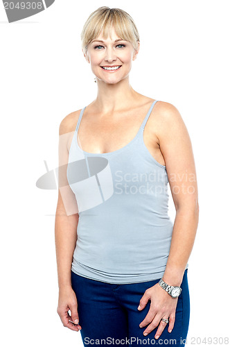 Image of Attractive middle aged woman in spaghetti top