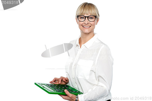 Image of Secretary using large green calculator