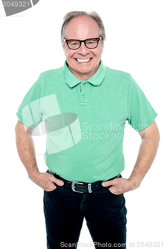 Image of Smartly dressed senior man posing for a portrait