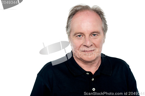 Image of Relaxed senior caucasian male looking at you