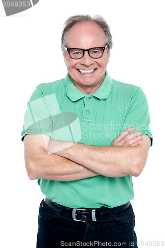 Image of Studio shot of a cheerful elderly man