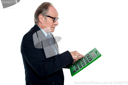 Image of Intent looking executive working on a calculator