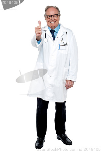 Image of Successful senior doctor showing thumbs up sign to the camera