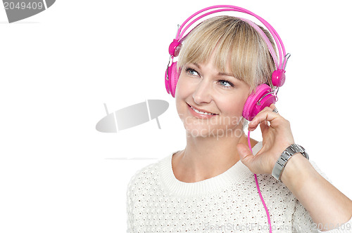 Image of Gorgeous woman listening to music