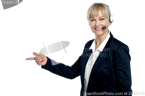 Image of Active employee pointing towards the copy space area
