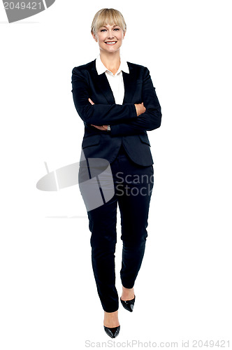Image of Gorgeous woman in business suit walking towards you
