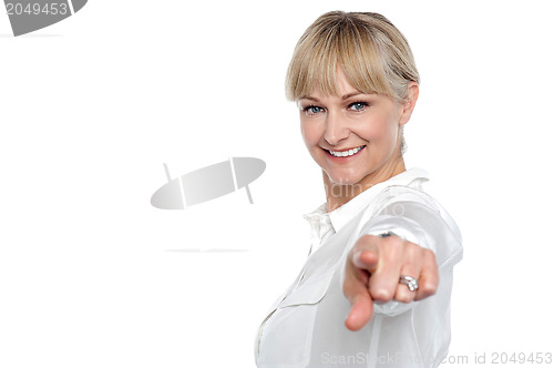 Image of Stylish corporate woman pointing at you