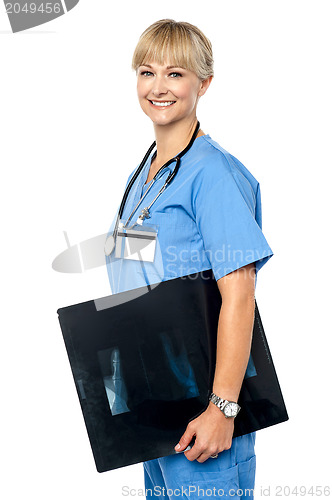 Image of Nurse holding x-ray sheet to be passed up to a senior doctor
