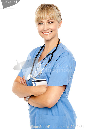 Image of Happy and confident doctor posing arms crossed