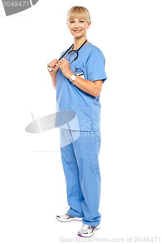 Image of Casual portrait of a confident physician standing sideways