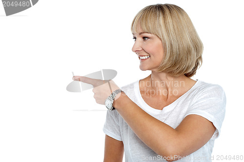 Image of Woman in casuals pointing sideways