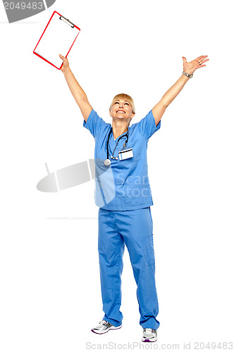 Image of Long shot of a jubilant doctor celebrating her success